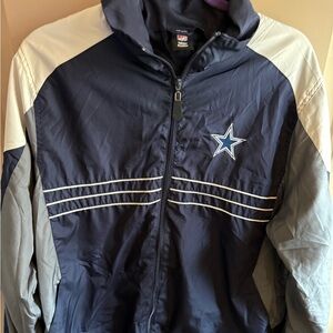 Vintage NFL Reebok Navy and Gray Dallas Cowboys zip up front wind breaker.